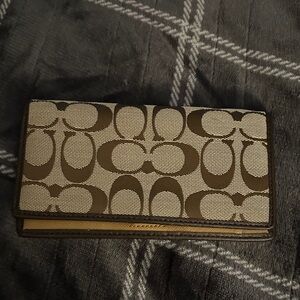 Coach check book cover